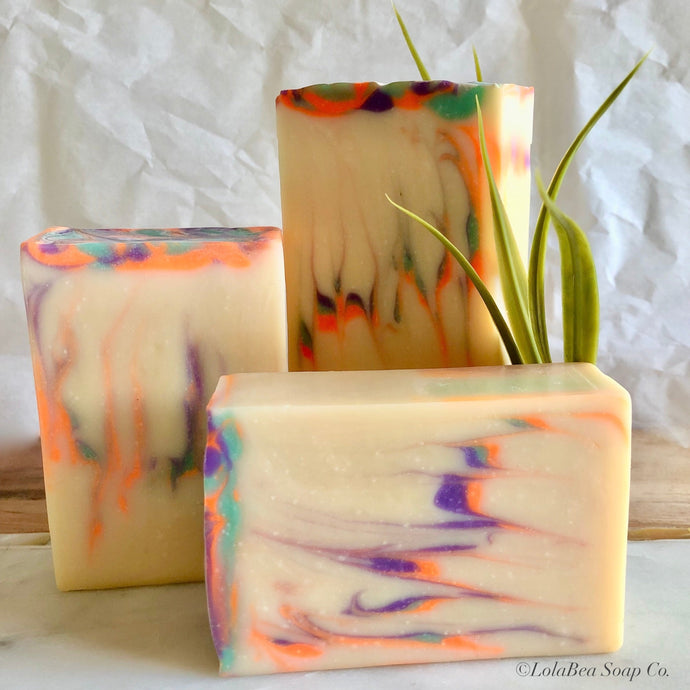 Vetiver goat milk soap. Handmade artisan soap bars. Cream, purple, blue and orange zigzag design.